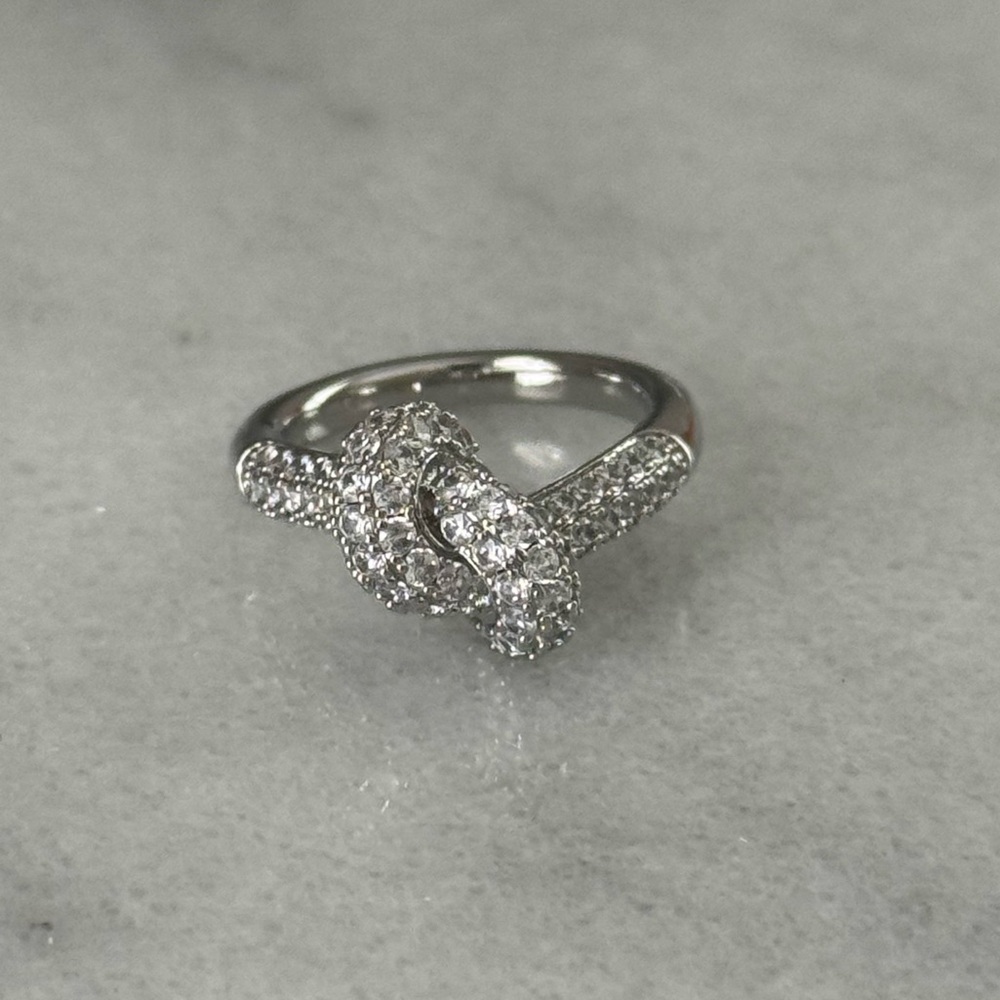 Silver Crystal Pave Knot Ring 

Brand New

Stainless Steel

Size 7